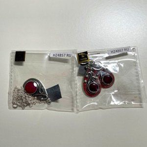 Silver earrings and necklace with berry red stones